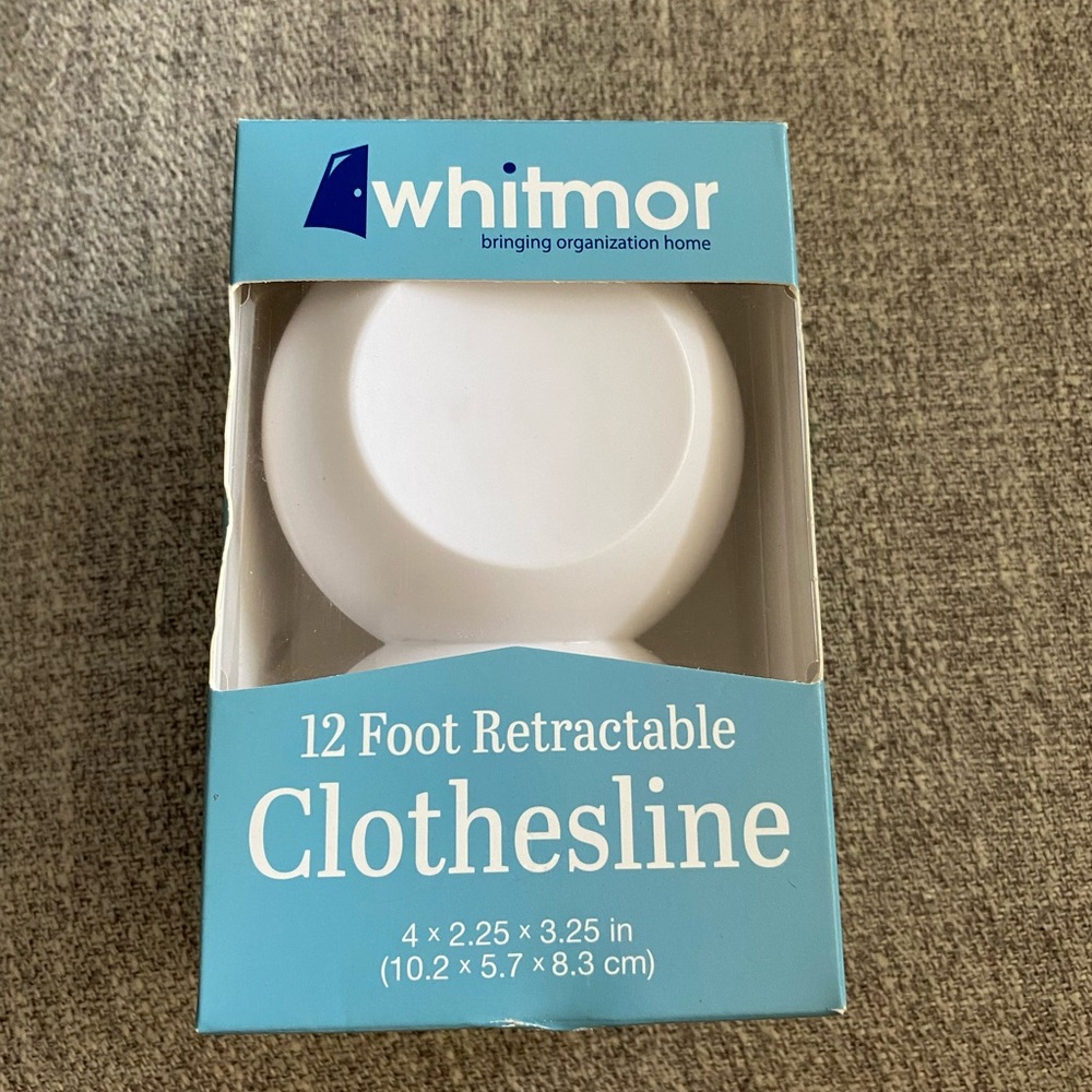 New, unopened box. 12ft retractable clothes line.